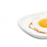 What is the calorie content of an egg fried without oil in a frying pan?