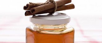 Cinnamon sticks and a jar of honey